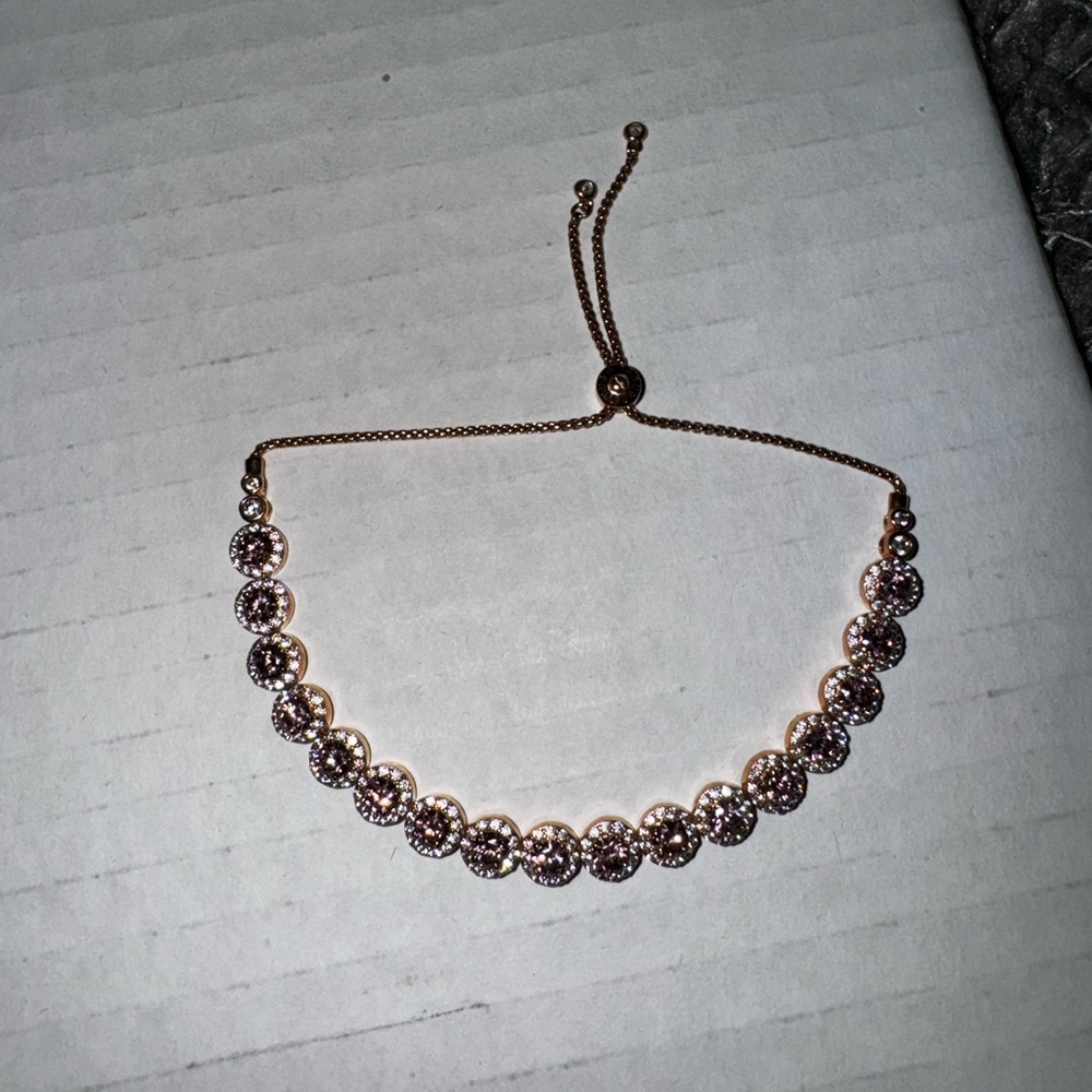 Henri Bendel luxe pave bracelet rose gold with burgundy stones.